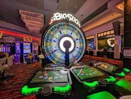 winzir Casino game selection showing live baccarat and roulette tables on screen